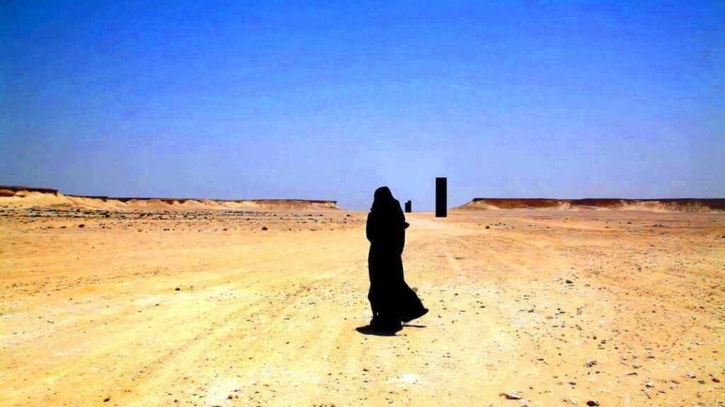 Image still from Suzannah Mirghani short film Hind's Dream taken at Richard Serra sculptures in Qatar